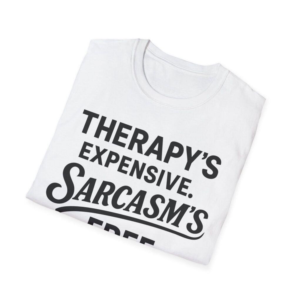 Folded white t-shirt reading "Therapy's expensive. Sarcasm's free
